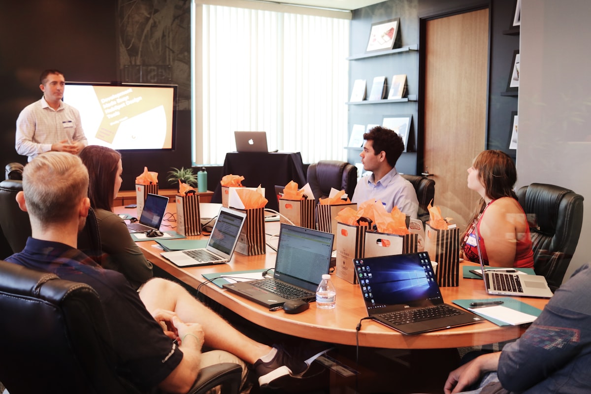 Professionals in a branded workplace meeting